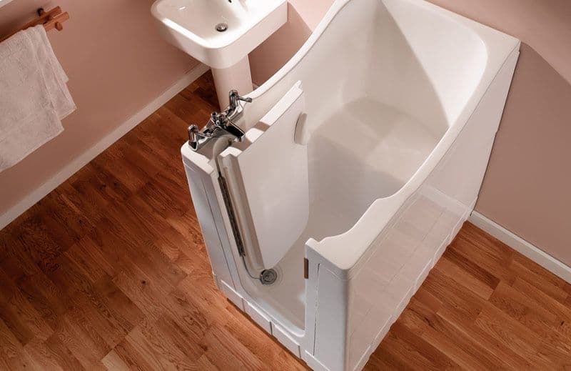 A walk-in bath provides easy access and added safety features for a comfortable bathing experience.